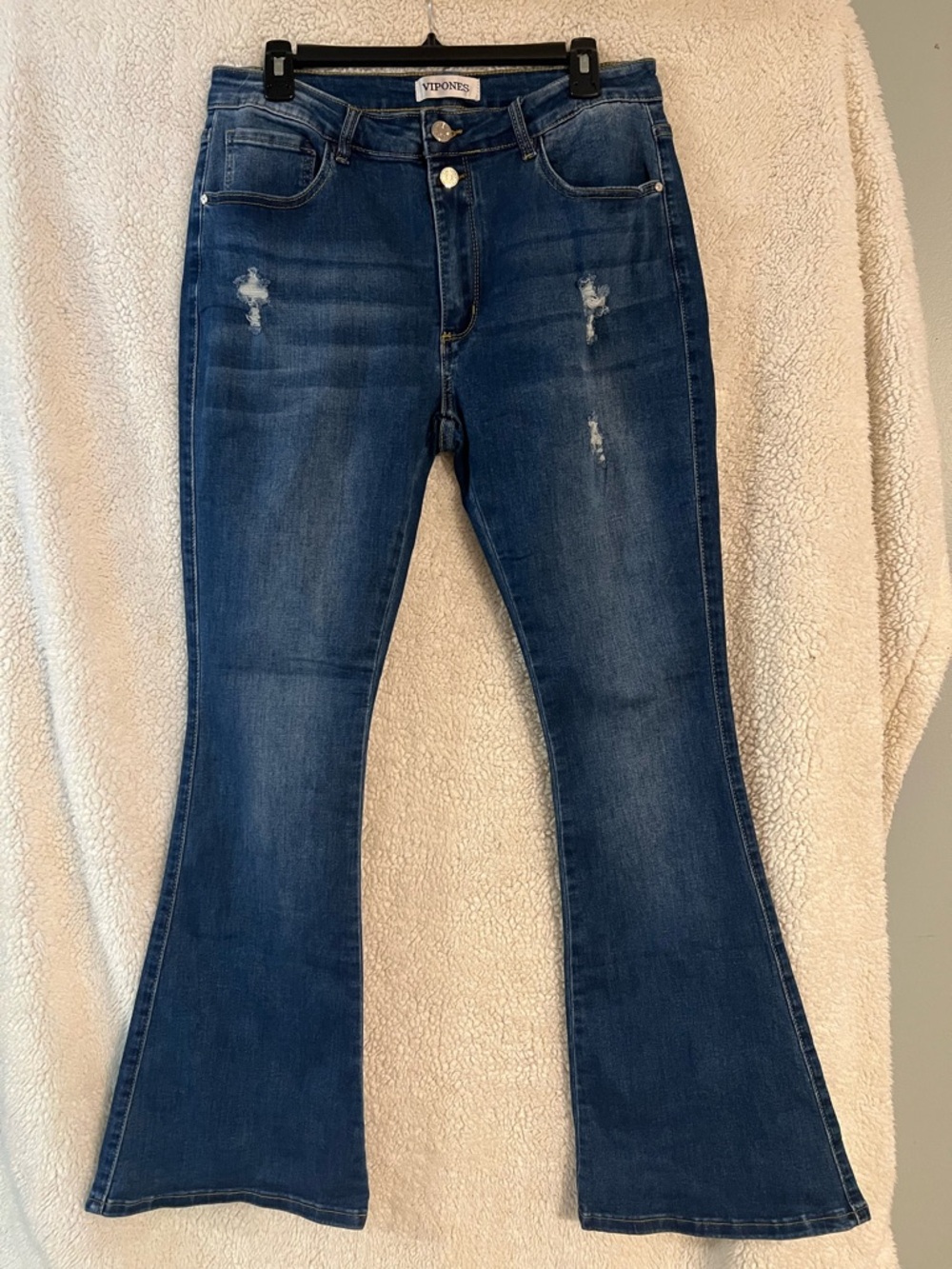 Dark Blue Flare Jeans with Subtle Distress. New W/O Tags. Never worn before!